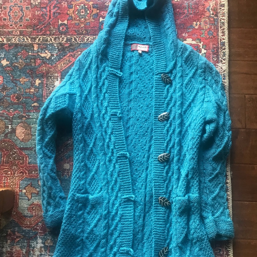 Long hooded blue sweater with fun buttons